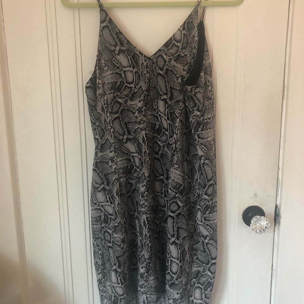 Snake print V-neck dress.